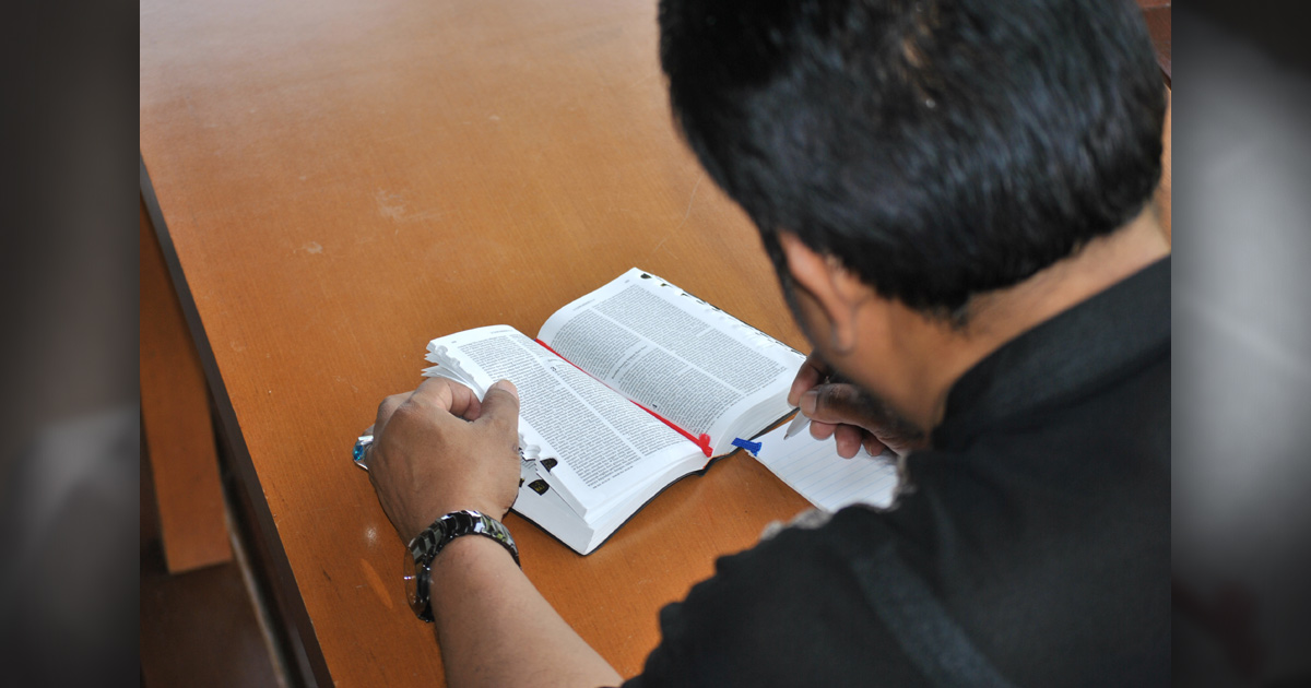 A man studying the Bible.