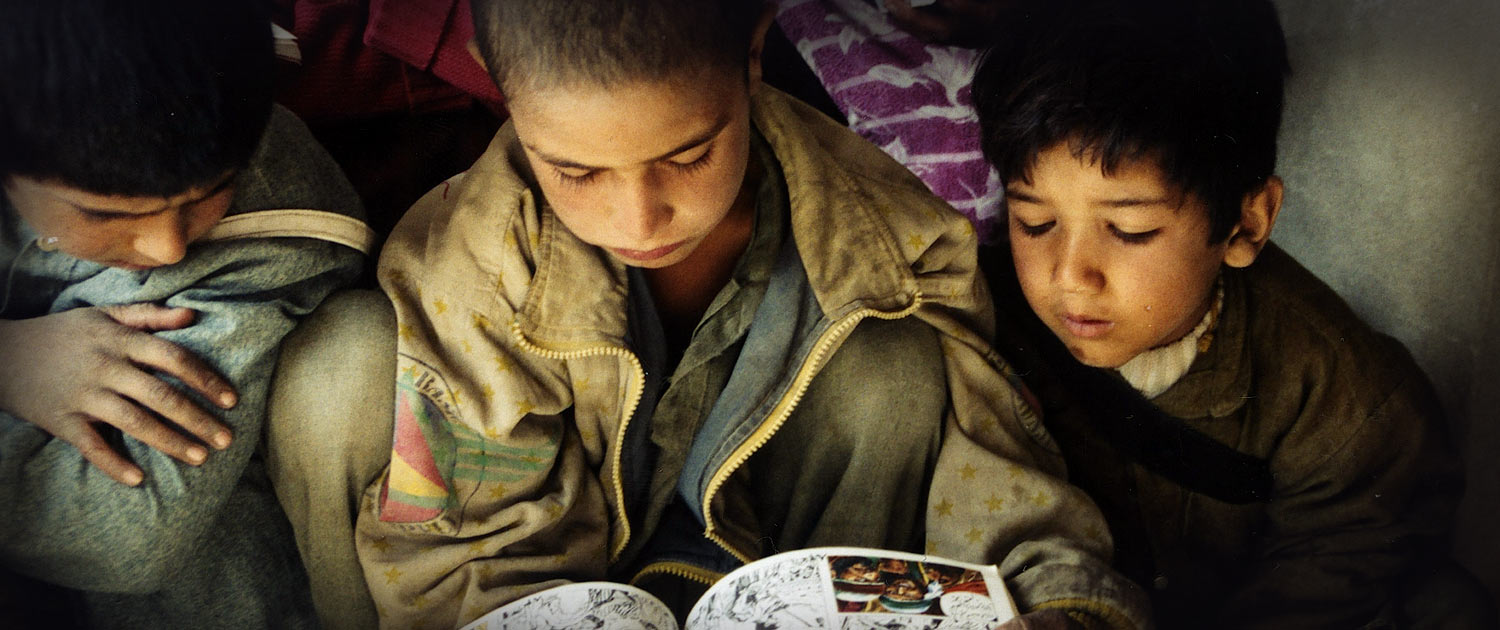 Children reading graphic version of the Bible - Photo: VOMC